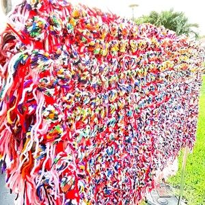 Hand made multi crocheted & fringed colorful open knit blanket or wall hanging.